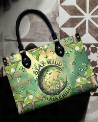 STAY WILD MOON CHILD LEATHER HANDBAG - TLNT3105245