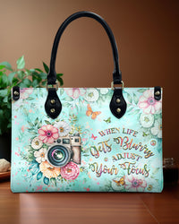 WHEN LIFE GETS BLURRY ADJUST YOUR FOCUS LEATHER HANDBAG - YHHG0107243
