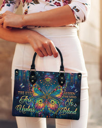 THE EYES ARE USELESS WHEN THE MIND IS BLIND BUTTERFLY LEATHER HANDBAG - TLPQ2406245